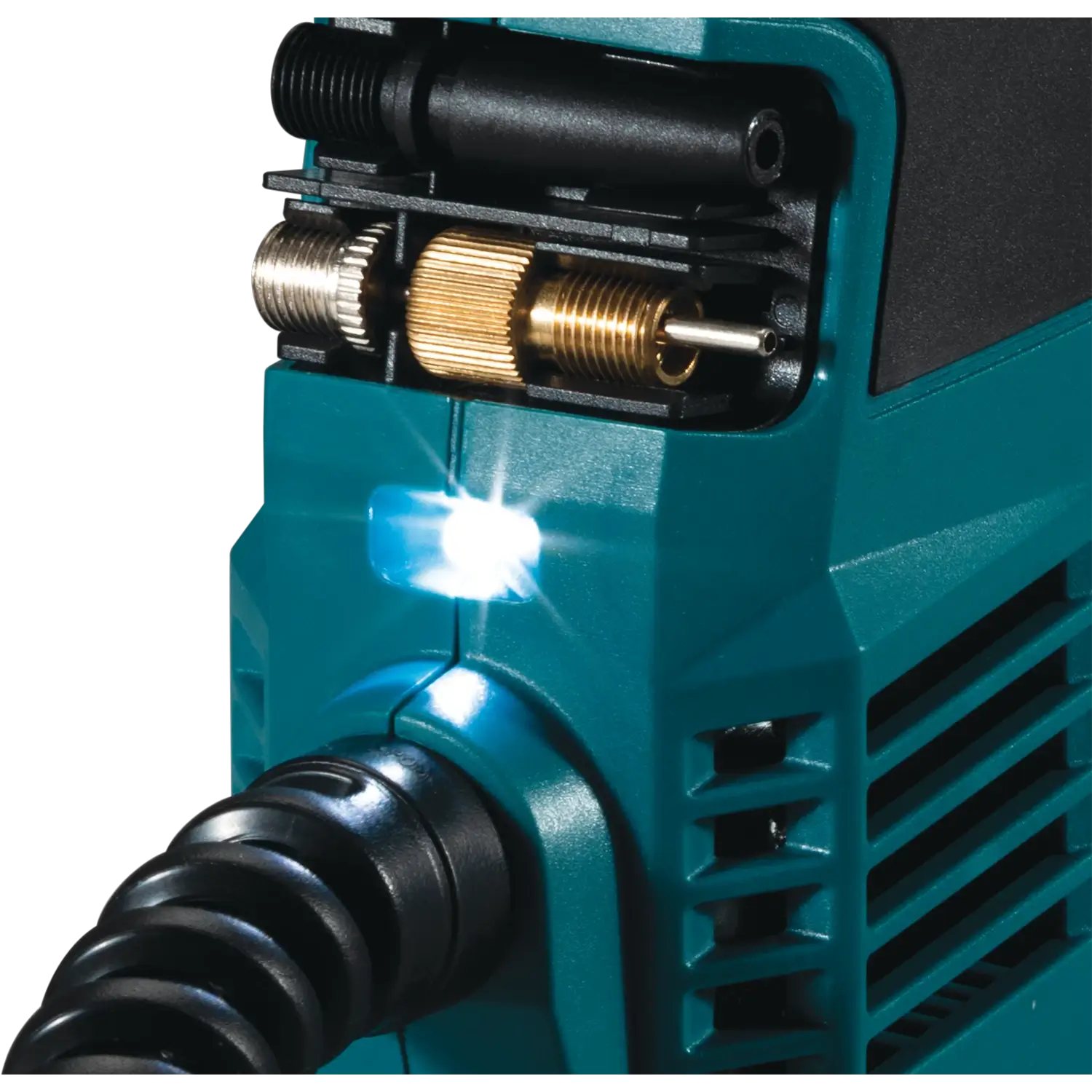 Close-up of a teal power tool with a black nozzle and brass fitting on a white background