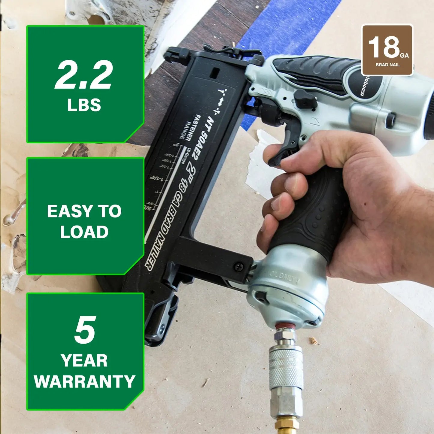 Hand holding a nail gun with features highlighted on a wooden surface