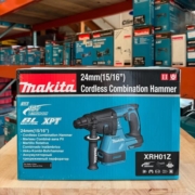 Makita XRH01Z 18V LXT Cordless Combination Hammer displayed on a warehouse shelf, with other Makita tool boxes stacked in the background.