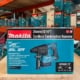 Makita XRH01Z 18V LXT Cordless Combination Hammer displayed on a warehouse shelf, with other Makita tool boxes stacked in the background.